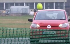 Playing tennis with cars