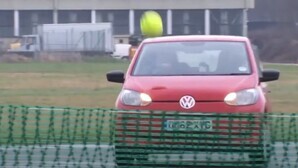 Playing tennis with cars