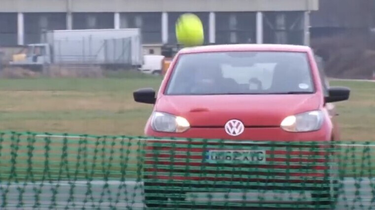 Playing tennis with cars