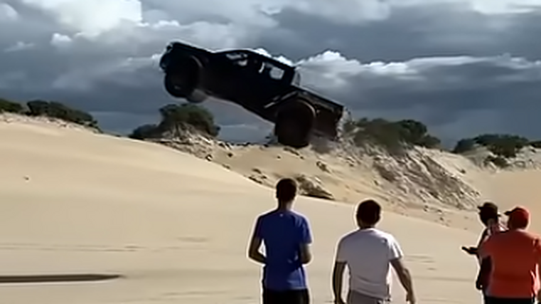 Ute in crazy sand dune jump