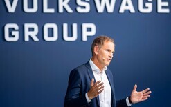 VW revises profit down